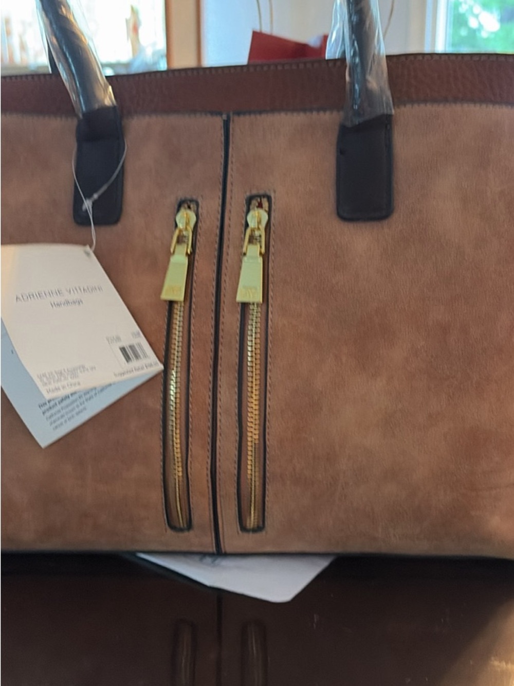 Adrienne Vittadini Black Leather Handbag with Red Interior and Gold Hardware